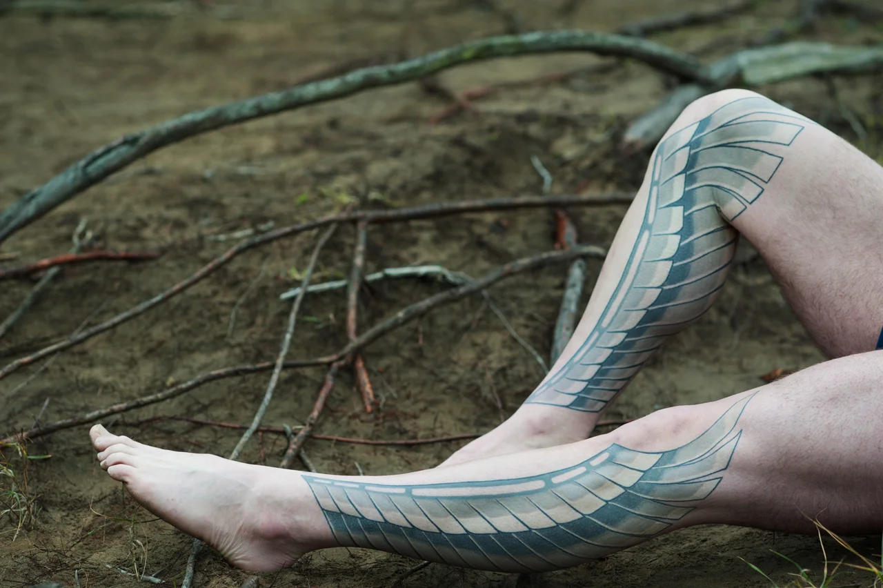 Geometric leg sleeve tattoo