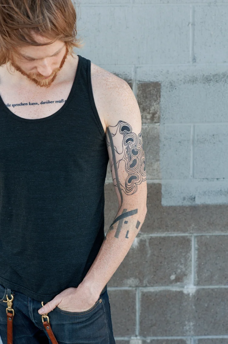 Black and grey arm tattoo